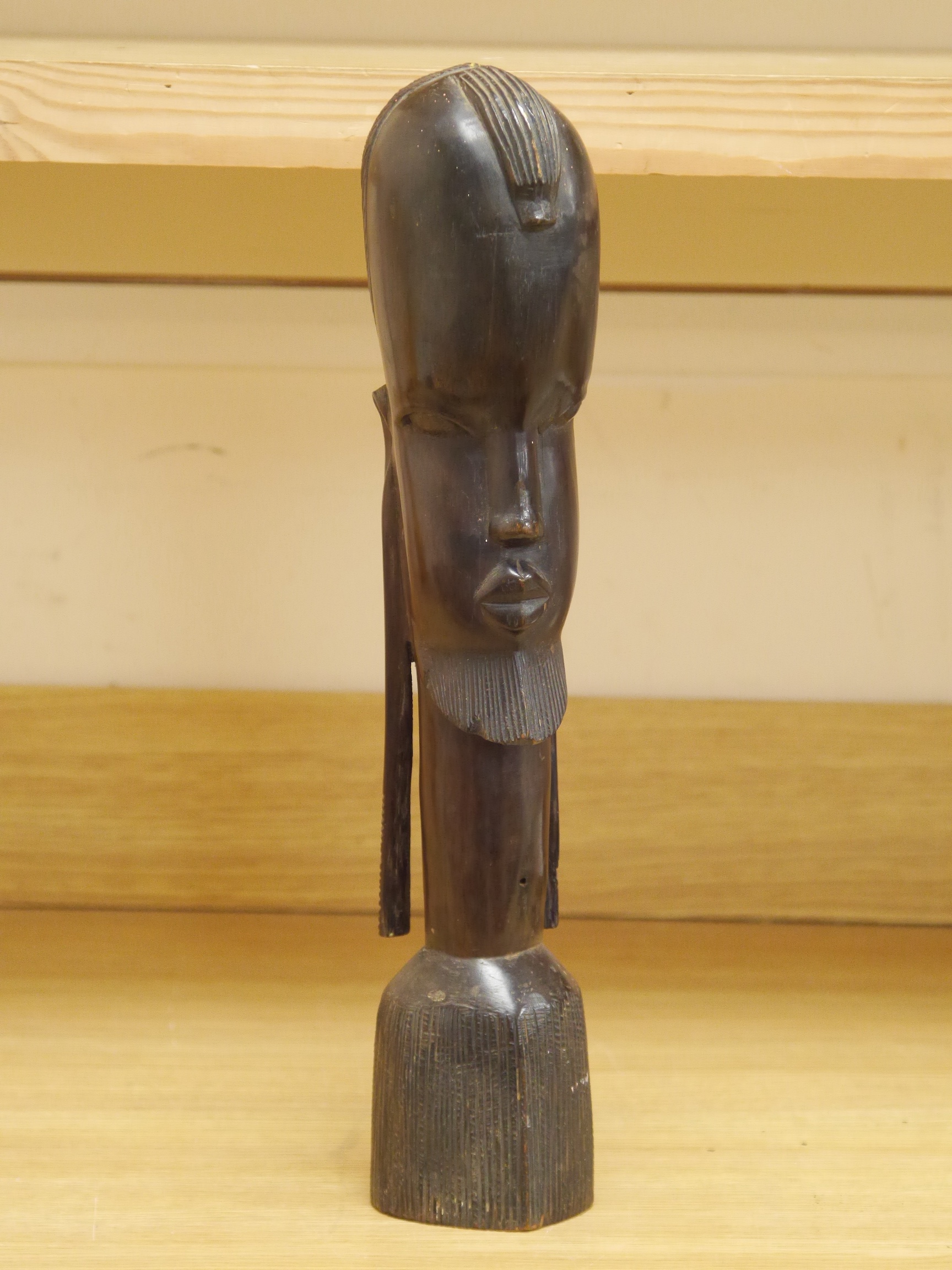 An African carved wood bust, 47cm high. Condition - good